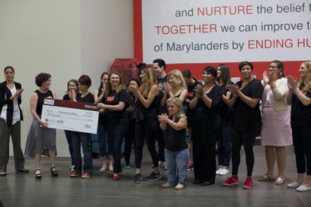 Vicki Lowell, EVP of Marketing for TLC, presented a $10K donation on behalf of TLC to Meg Kimmel, VP of Marketing and Communication for the Maryland Food Bank