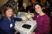 Sisters Paula Dunn of Linthicum Heights and Robin Hein of Pasadena share tea cups that once belonged to their mother