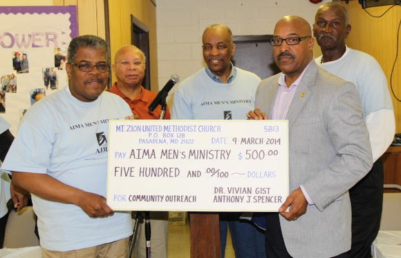AIMA Men’s Ministry receives $500  donation at prayer breakfast
