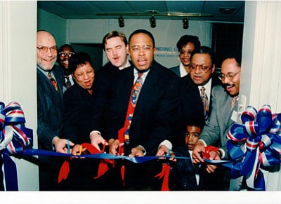 Opening of the Charles Street office of Development Credit Fund (Front row, left to right): Daniel P. Henson, III: Diane Bell-McKoy; former Baltimore mayor, Kurt L. Schmoke; Ackneil M. Muldrow, II; Harold D. Young; and grandson, Charles “Chaz” Scott
