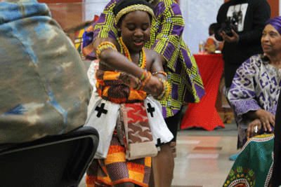 Benita Biney, 10. shows off the Ghanaian dance, Adowa at the Sankofa Children's Museum  on Saturday October 26, 2019 in Baltimore.