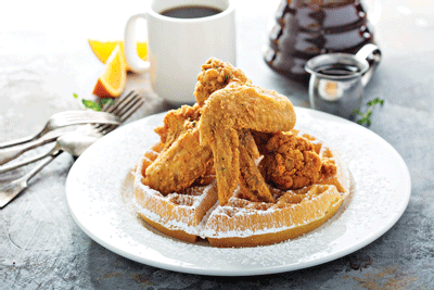 A plate of chicken and waffles on of the many selections on the restaurant’s menu. Ferrell has plans to open a restaurant in the Baltimore area in the future. 