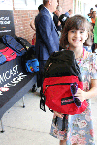 Student proudly shows off her backpack filled with school supplies. Comcast Spotlight teamed up with the Kids In Need Foundation to donate backpacks with school supplies to students nationwide including here in Baltimore.