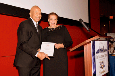 Congressman Elijah E. Cummings presents Publisher Joy Bramble with a Congressional Achievement Award at The Baltimore Times 30th anniversary celebration held at the Reginald F. Lewis Museum in 2016.