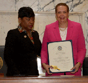 (Left to right) Speaker Pro Tem Adrienne Jones of The Maryland House of Delegates presents the House Resolution to Joy Bramble in recognition 33 years of publishing the Baltimore Times and the unveiling of her Wax Figure as a Woman in The Media.
