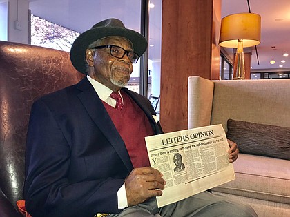 Dr. E. Lee Lassiter holds a copy of his column featured in the September 23, 1985 edition of The News American. In 1965, Dr. Lassiter became the second African American to be hired by the paper in the Editorial department. The retired journalist and former Coppin State University college professor graduated from Tuskegee Institute (now Tuskegee University) in 1959 with a B.S. degree in Secondary Education. He received an M.S. in Journalism from Boston University in 1963. He would later earn a doctorate from Morgan State University in 1994.