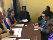 Kayura Gwynn (middle) in Washington, D.C. with her father Marcel Gwynn (left) his wife Jen speaking with Walter Gonzales (across the table) Legislative Director in Representative Dutch Ruppersberger's (D-MD) office.