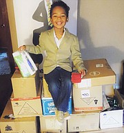 Five-year-old kidpreneur Tyler Stallings with all the donations he collected for MCVET, an nonprofit organization that helps homeless veterans in the Baltimore area.  