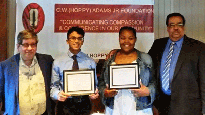 Dr. Larry Blum presented the awards to Hoppy Adams Foundation 2019 Essay Contest winners. (Left to right) First place winner, Jibreel Ali of South River High School; second place winner, Mikayla Simms of Annapolis High School; and Charles Adams III the son of the late renowned radio personality, Hoppy Adams. Third place winner Alexis Seidel was unable to attend the event.