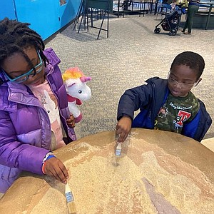 (Left) Samia and Uriyah Ma’at; and Ji’Air Ford (right) attended the Annual Casey Cares Holiday Party at the Maryland Science Center on Saturday, December 14, 2019.