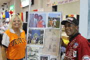Linda Warehime Butcher and Ray Banks share a moment at her photo stand at The Maryland State Fair.