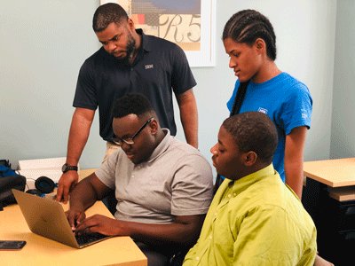De'Rell with Summer 2019 Interns Maniyah McBride (standing), (Seated): Kamal Adams (left)  and Gabriel Day.
