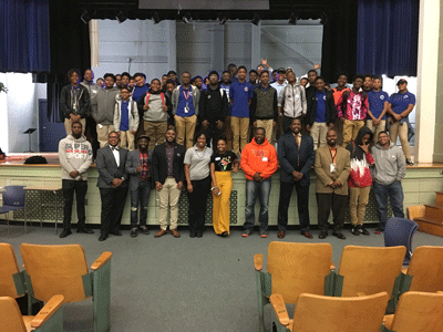 P-Tech students and community members gather for a photo following a male empowerment event with non-profit Hello, My Name is King on the 23rd anniversary of the Million Man March.