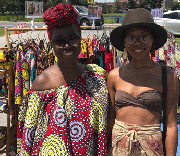 Akos Regal (left) of Regal Clothes with a Montebello Market customer