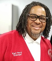 Karl Perry, a 1985 graduate of Calvert Hall, is the principal of Edmondson High School.
