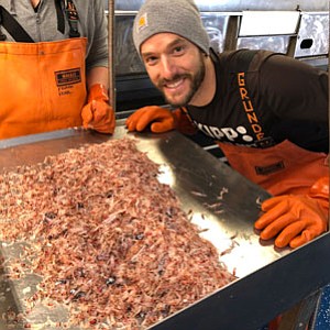 Justin Garritt analyzing a pile of krill that was caught outside of the Port of Newport 