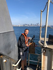 Justin Garritt calibrating the research equipment in the Port of Seattle aboard NOAA Bell A.  Shimada.