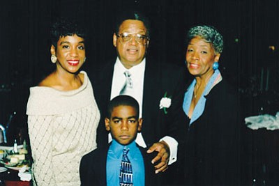 Left-right: Denise McCray Scott, daughter; Ackneil M. Muldrow, II; Ruth Muldrow, wife: and grandson, Charles “Chaz” Scott.