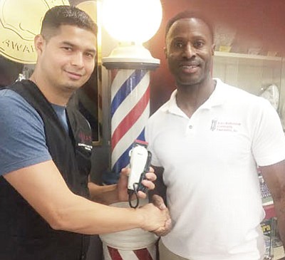 Volunteer barbers give free haircuts
