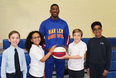 Buckets Blakes of the Harlem Globetrotters visits local schools