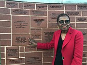 “A Family Affair.” Williams touches a brick on the BCCC Brick Wall of Recognition, which includes her name, along with the names of her husband and daughter. The three are all graduates of the school