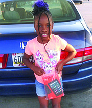 Eight-year-old Diamond is all smiles with her new tablet