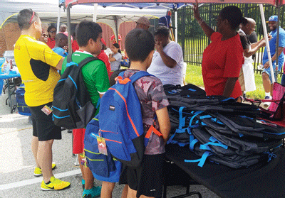 Moon’s Barbershop and the Boys and Girls Club at Wiley H. Bates Heritage Park gave families a helping hand on Sunday, August 12, 2018.  300 backpacks filled with school supplies were distributed to students. Pony rides, a moon bounce, games, tattoos, face painting, snowballs, food face painting and music were also provided during the fun-filled afternoon in Annapolis. 