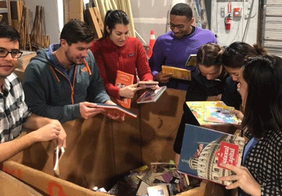 Volunteers from Johns Hopkins University sort donated books at the Maryland Book Bank.