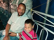 Rodney Lindsey and son Stephen, age 6, enjoy UniverSOUL circus experience.