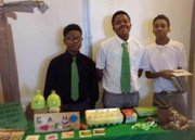 Green Street Academy students show off produce made possible through the urban agriculture component of the charter school’s curriculum.          