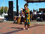 Young dancer from Keur Khaleyi African Dance Company performs