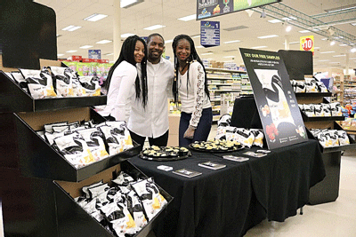 The Anderson Family stationed at their Symphony Chips display in Wayfield Foods on MLK Drive in Atlanta, Georgia
